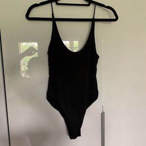 Soft slinky black body suit
